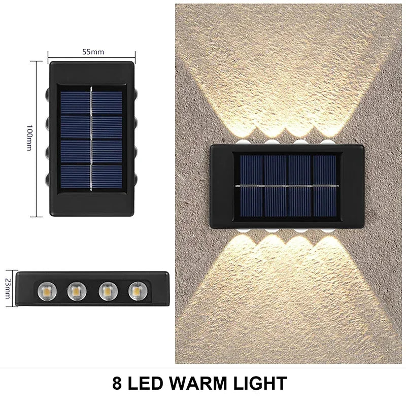 éclairage LED sur un mur de jardin, créant une ambiance chaleureuse en soirée.